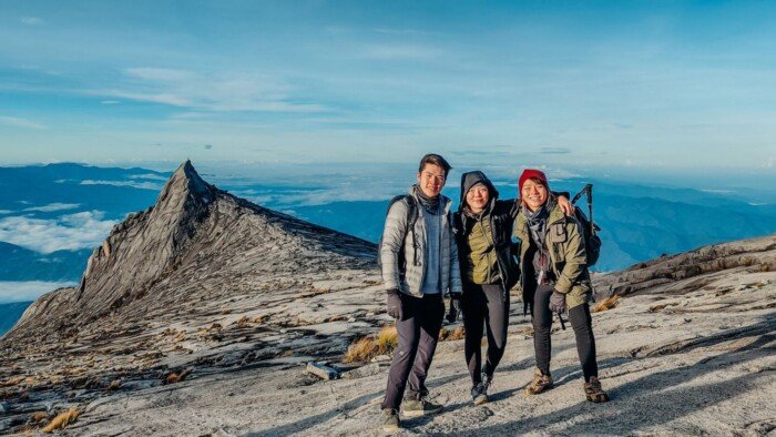 Three People on Top on Mount Kinabalu